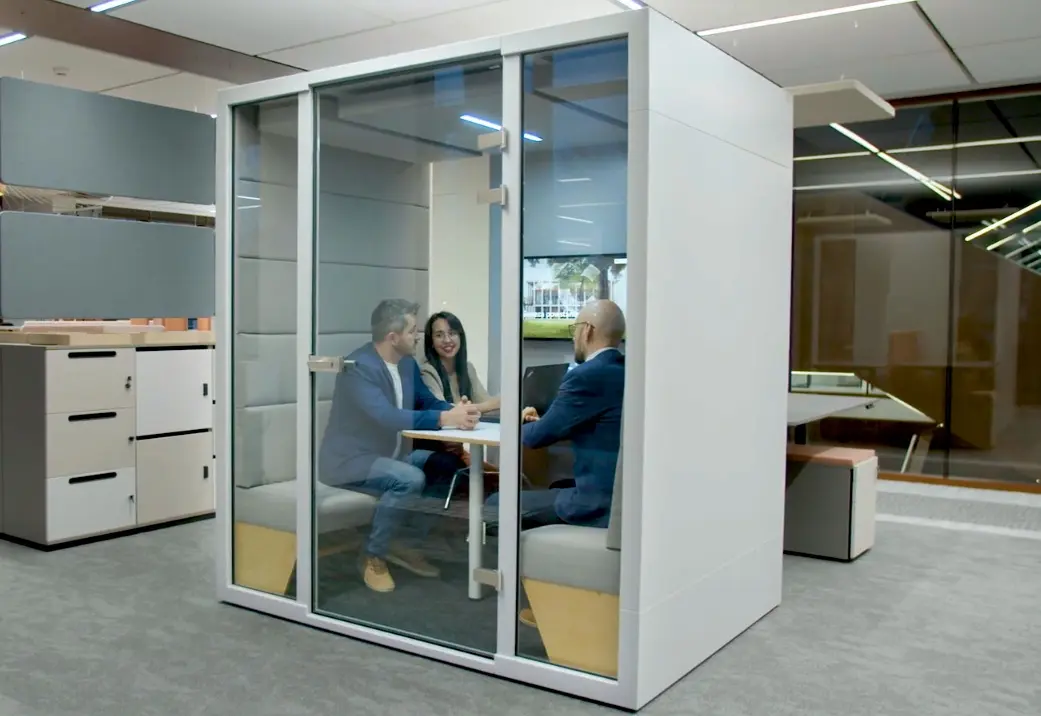 L acoustic cabin for office — 4 people sitting at table on comfortable built-in seats