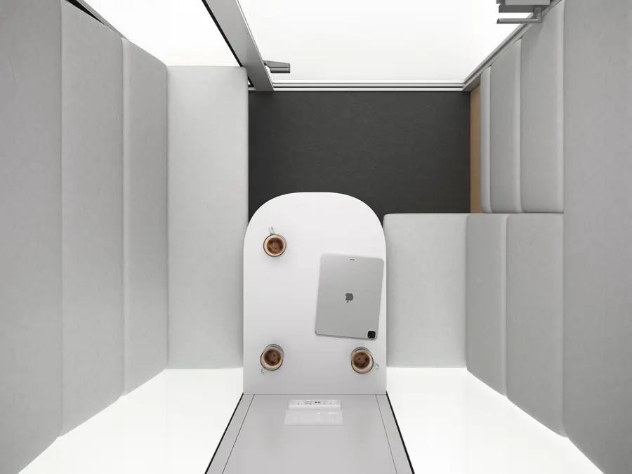 M3 acoustic cabin — top view of interior with seating for 3 people and a table
